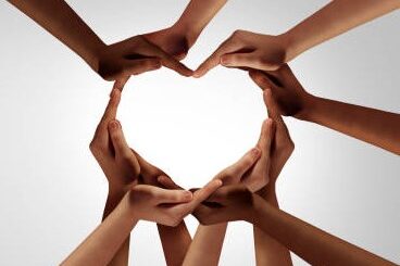 hands coming together in the shape of a heart
