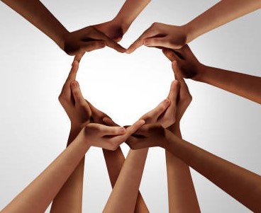 hands coming together in the shape of a heart