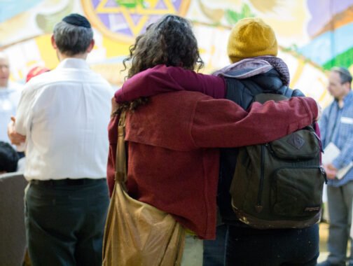 People hugging from behind